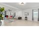 Spacious living room featuring tile floors, a ceiling fan, and comfortable seating area, illuminated by natural light at 5317 Patano Loop, Palmetto, FL 34221
