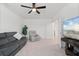 Relaxing living room with a comfortable sofa, armchairs, and a ceiling fan, offering a perfect spot to unwind and watch tv at 5317 Patano Loop, Palmetto, FL 34221