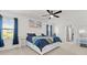 Serene main bedroom featuring a comfortable bed, stylish decor, and bright natural light at 5317 Patano Loop, Palmetto, FL 34221