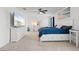 Calm main bedroom featuring a large bed, stylish furniture, a ceiling fan, and soft carpeting at 5317 Patano Loop, Palmetto, FL 34221