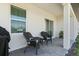 Covered patio with brick pavers and comfortable seating at 5317 Patano Loop, Palmetto, FL 34221