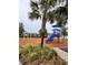 Community playground with slide and play structures, perfect for outdoor fun at 5317 Patano Loop, Palmetto, FL 34221