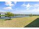 Scenic pond view with lush landscaping and serene surroundings at 5317 Patano Loop, Palmetto, FL 34221