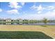 Scenic view of the pond behind the house, offering serene views from the backyard at 5317 Patano Loop, Palmetto, FL 34221