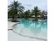 Enjoy the community pool with palm trees, lounge chairs, and shaded cabanas at 5317 Patano Loop, Palmetto, FL 34221