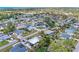 This aerial view shows a lovely home nestled in a charming neighborhood with lush greenery at 5322 Syracuse Rd, Venice, FL 34293