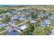 This aerial view shows a lovely home nestled in a charming neighborhood with lush greenery at 5322 Syracuse Rd, Venice, FL 34293