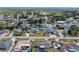 Aerial view showcasing the neighborhood's tranquil, tree-lined streets and well-maintained homes at 5322 Syracuse Rd, Venice, FL 34293