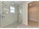 Modern walk-in shower with glass door and white marble walls at 5322 Syracuse Rd, Venice, FL 34293