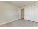 This bedroom features a closet with sleek white doors and a view into an adjacent room at 5322 Syracuse Rd, Venice, FL 34293