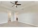 The bedroom boasts gray wood flooring, neutral-toned walls, and convenient bathroom access at 5322 Syracuse Rd, Venice, FL 34293