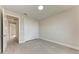 This bedroom features a closet with white doors and modern gray floors at 5322 Syracuse Rd, Venice, FL 34293