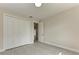 This bedroom showcases a closet with sleek white doors and a view into an adjacent room at 5322 Syracuse Rd, Venice, FL 34293