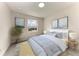 Cozy bedroom setup with a window view, complemented by elegant art and harmonious décor at 5322 Syracuse Rd, Venice, FL 34293