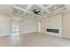 Bright living room features a modern fireplace, recessed lighting, and beautiful coffered ceiling with ceiling fan at 5322 Syracuse Rd, Venice, FL 34293