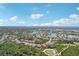 An expansive aerial view of a vibrant community, showcasing lush greenery, sparkling lakes, and a golf course at 5412 Royal Poinciana Way, North Port, FL 34291