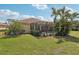 Lush backyard showcasing the pool, patio, and meticulously maintained lawn at 5412 Royal Poinciana Way, North Port, FL 34291