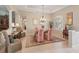Elegant dining area featuring tile floors, tray ceilings, and classic furnishings at 5412 Royal Poinciana Way, North Port, FL 34291