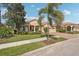 Beautiful home with a red tile roof, three-car garage, and manicured landscaping at 5412 Royal Poinciana Way, North Port, FL 34291