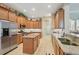 Modern kitchen with granite countertops, stainless steel appliances, and ample cabinet space at 5412 Royal Poinciana Way, North Port, FL 34291