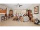 Open-concept living room with tile floors, high ceilings, and a seamless flow to other areas at 5412 Royal Poinciana Way, North Port, FL 34291