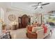 Spacious living room with high ceilings, comfortable seating, and access to the lanai at 5412 Royal Poinciana Way, North Port, FL 34291