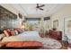 Serene main bedroom with tray ceilings, plantation shutters, hardwood floors, and custom decor at 5412 Royal Poinciana Way, North Port, FL 34291