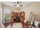 Spacious home office with built-in desk, hardwood floors, and ample natural light at 5412 Royal Poinciana Way, North Port, FL 34291