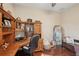 Home office with custom wooden desk, hardwood floors, and bench at 5412 Royal Poinciana Way, North Port, FL 34291