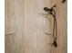 Modern shower featuring stone-look tile and a multi-setting shower head at 5412 Royal Poinciana Way, North Port, FL 34291
