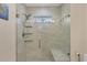 Bathroom features a frameless glass shower with a built-in bench at 5712 Garden Lakes Fern, Bradenton, FL 34203