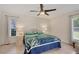 Bright bedroom features tiled floor, ceiling fan and beach themed decor at 5712 Garden Lakes Fern, Bradenton, FL 34203