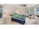 Bright bedroom features tiled floor, ceiling fan and beach themed decor at 5712 Garden Lakes Fern, Bradenton, FL 34203