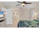 Cozy bedroom with a ceiling fan, closet, and ensuite bathroom at 5712 Garden Lakes Fern, Bradenton, FL 34203