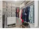Organized walk-in closet with custom shelving, hanging rods, drawers, and space for shoes and accessories at 5712 Garden Lakes Fern, Bradenton, FL 34203