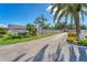 Inviting entrance to Garden Lakes, showcasing well-manicured landscaping and a glimpse of the community beyond at 5712 Garden Lakes Fern, Bradenton, FL 34203