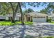 Attractive home with brick accents and a well-manicured lawn, creating a picturesque setting for suburban living at 5712 Garden Lakes Fern, Bradenton, FL 34203