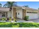 Charming single-story home with a brick-accented entrance, well-maintained landscaping, and a two-car garage at 5712 Garden Lakes Fern, Bradenton, FL 34203