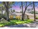 Charming single-story home with a well-manicured lawn and mature trees, offering a serene and inviting curb appeal at 5712 Garden Lakes Fern, Bradenton, FL 34203