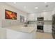 Bright kitchen with modern appliances, white cabinets, and ample counter space at 5712 Garden Lakes Fern, Bradenton, FL 34203