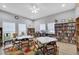 Library featuring ample seating, shelves filled with books, and a colorful rug at 5712 Garden Lakes Fern, Bradenton, FL 34203