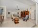 Bright and airy living room with tile floors, high ceilings, and stylish furnishings for comfortable living at 5712 Garden Lakes Fern, Bradenton, FL 34203