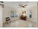 Bright office space featuring a large window, desk, and neutral flooring at 5712 Garden Lakes Fern, Bradenton, FL 34203