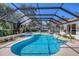 Lovely screened-in pool and spa with a spacious deck, perfect for outdoor entertaining and relaxation at 5712 Garden Lakes Fern, Bradenton, FL 34203