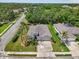 An aerial view of a well-maintained home, complete with a manicured lawn and lush landscaping at 5907 90Th Avenue E Cir, Parrish, FL 34219