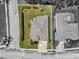 Aerial view showcasing property lines, mature landscaping, and proximity to a neighborhood pool at 5907 90Th Avenue E Cir, Parrish, FL 34219