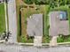 Birds eye view of a landscaped property with a spacious backyard, mature trees, and a cozy screened porch at 5907 90Th Avenue E Cir, Parrish, FL 34219