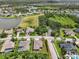 An aerial view of a residential area with a lush tree canopy, tranquil lakes, and beautiful houses at 5907 90Th Avenue E Cir, Parrish, FL 34219
