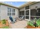 Backyard patio with a cozy fire pit and comfortable seating, plus views of the screened porch at 5907 90Th Avenue E Cir, Parrish, FL 34219