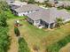 Aerial view of backyard with screened patio, lush lawn, and landscaping at 5907 90Th Avenue E Cir, Parrish, FL 34219